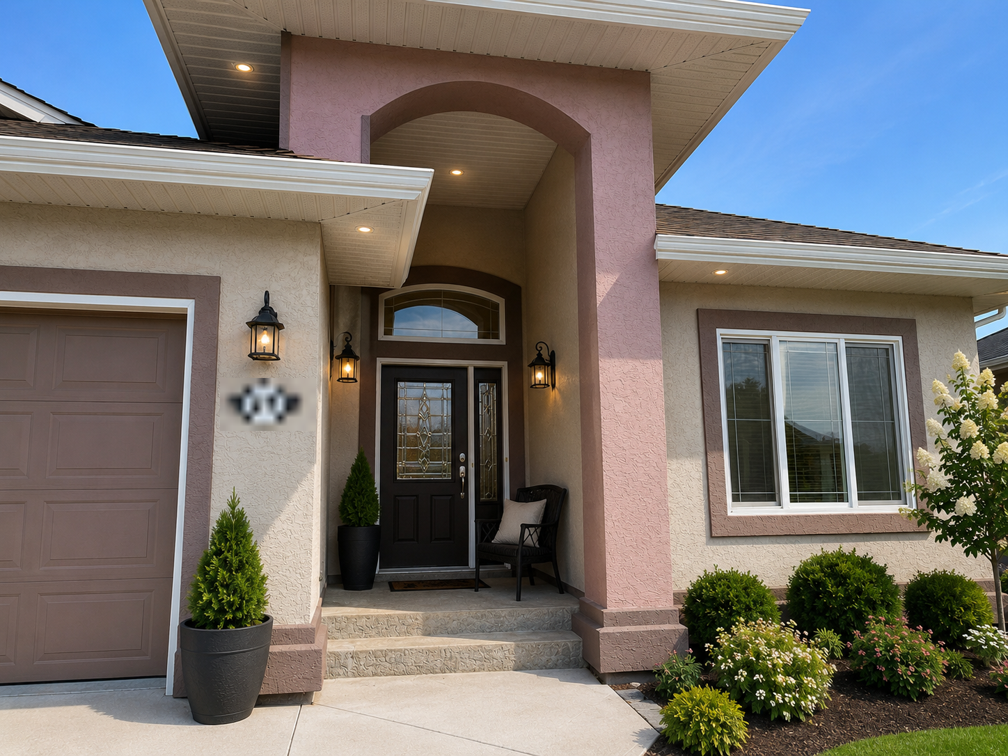 After: repainted stucco entryway with fresh warm tones